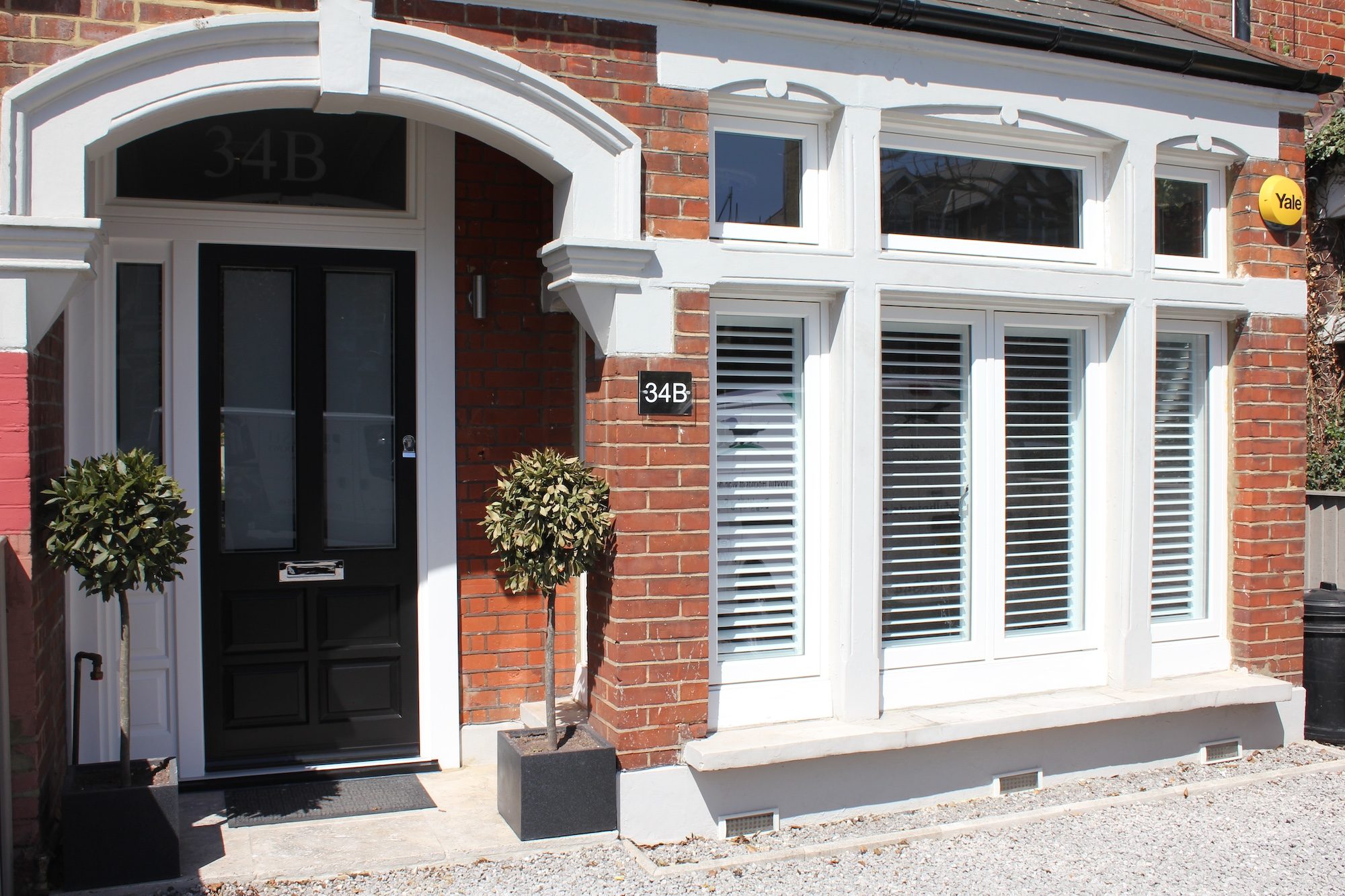 Nine Zero - Timber Black Front Door and White Flush Casement Windows