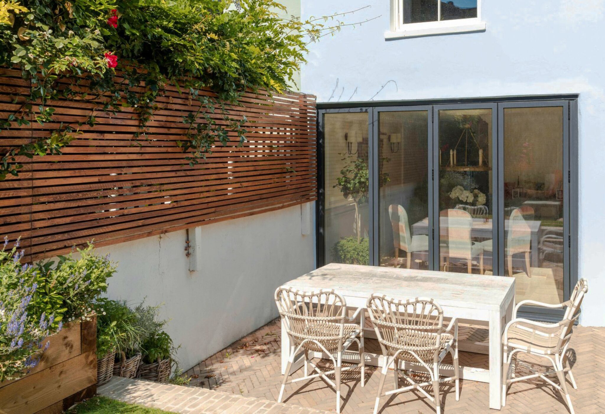 Snowbury-Road-Fulham-Aliuminium-Bifold-Doors-Into-Garden-2048x1403
